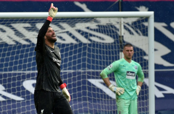 Liverpool goalkeeper Alisson Becker (left)dedicated his winning goal over West Brom to his late father