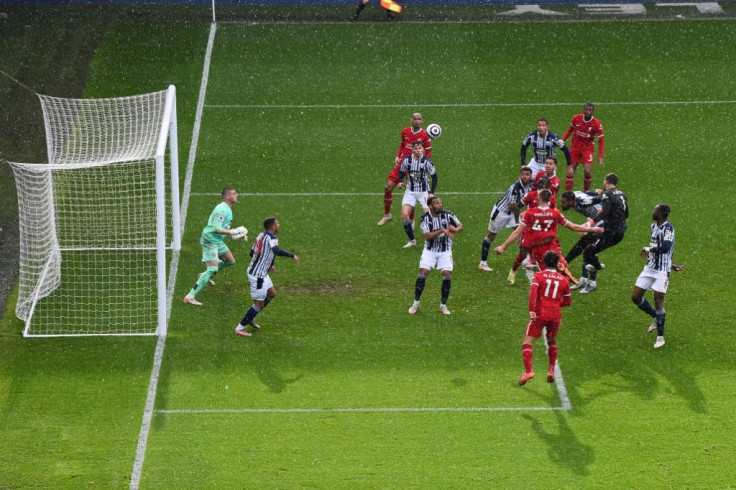 What a moment: Liverpool goalkeeper Alisson Becker heads in the winner against West Brom