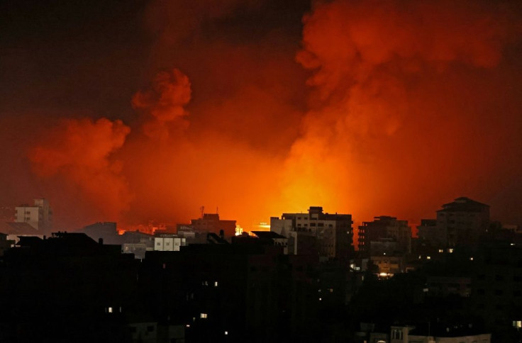 Smoke billows from a fire following Israeli airstrikes on multiple targets in Gaza City, controlled by the Palestinian Hamas movement, early on May 16
