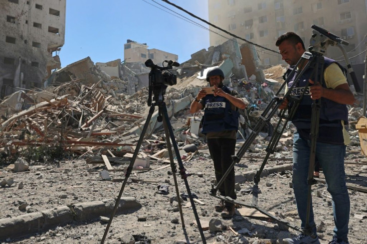 An Israeli air strike demolished the 13-floor building housing Qatar-based Al Jazeera television and American news agency The Associated Press in the Gaza Strip