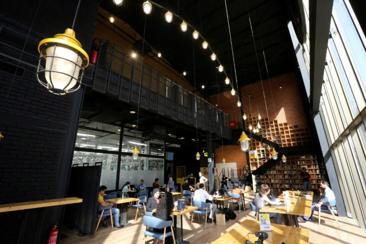Iraqis tap away at computers and mobile devices at co-working space The Station in Baghdad