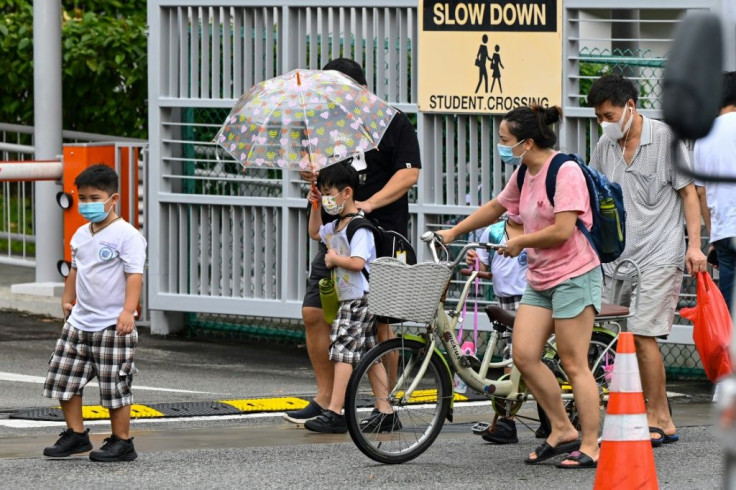 Singapore has tightened restrictions because of a fresh outbreak, including the closure of schools