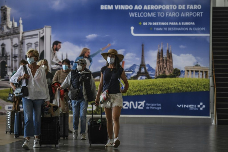 Tourists arrive at Faro airport in Portugal as the country eased restrictions
