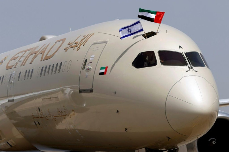 An Etihad Airways passenger plane displays Israeli and Emirati flags after landing at Israel's Ben Gurion airport on  April 6, the first such flight from the United Arab Emirates