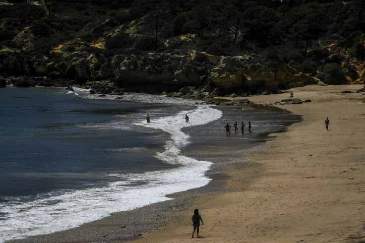 Only around 20 people took advantage of the warm sun and waters at Oura beach in the Algarve