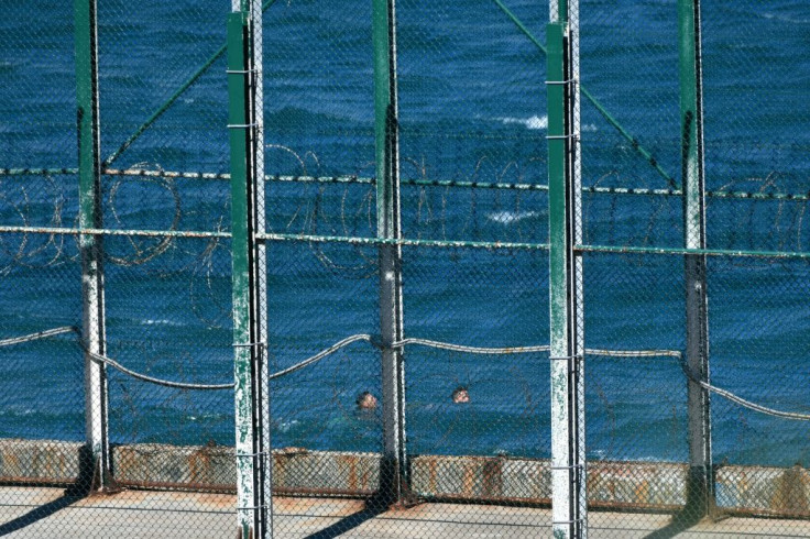 Migrants swim to the Spanish enclave of Ceuta from neighbouring Morocco on May 17, 2021