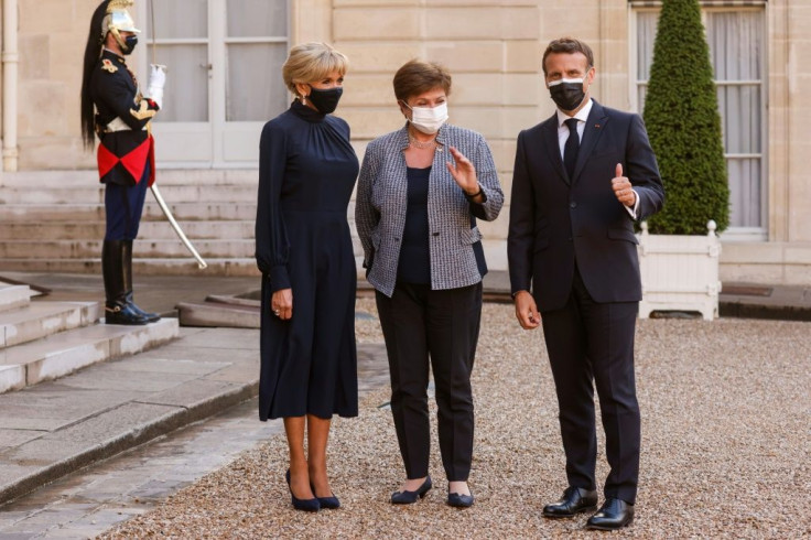 IMF chief Kristalina Georgieva, flanked by Macron and wife Brigitte