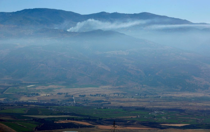 Smoke billows from a southern Lebanese border village following overnight Israeli shelling after rockets were fired from Lebanon into Israel