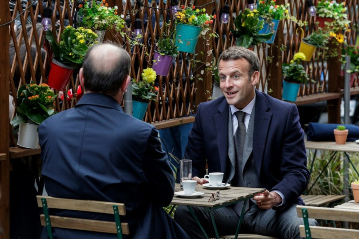 President Emmanuel Macron and Prime Minister Jean Castex enjoy a first coffee at a cafe close to the presidential palace