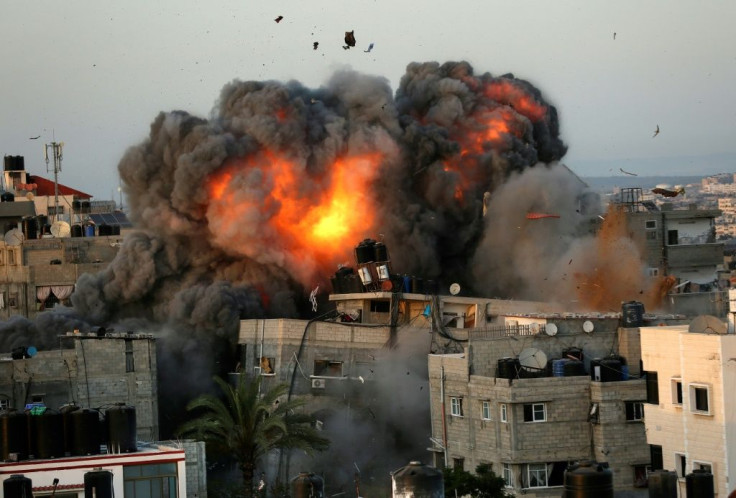 A ball of fire erupts from a building in Gaza City's Rimal residential district on May 16 during Israeli bombardment on the Hamas-controlled enclave