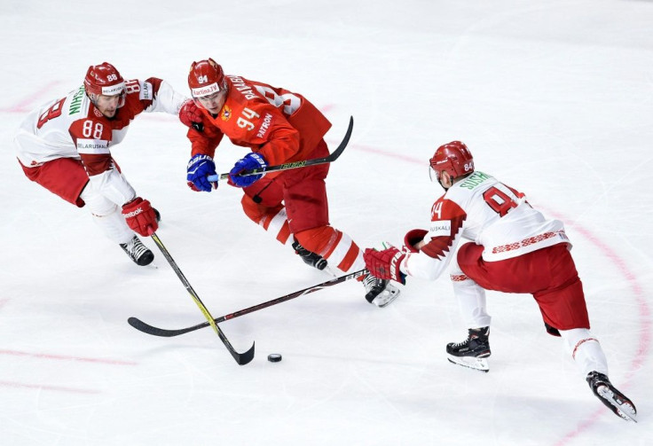 The Belarus team, playing in white here against Russia in 2018, will be at the world championships even though they lost the right to co-host with Latvia