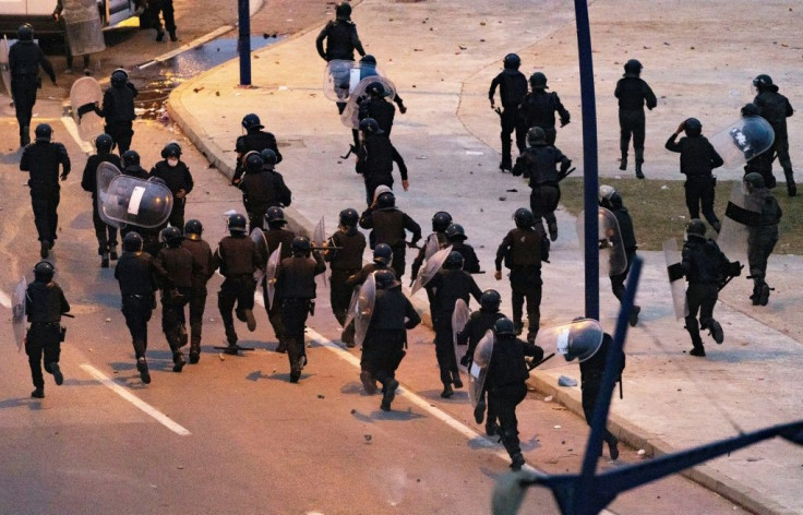 Moroccan riot police retreated as youths threw stones near the border
