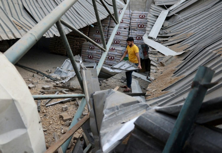 A Palestinian man walks in a factory destroyed by an Israeli air strike in Jabaliya, in the northern Gaza Strip, on May 20, 2021
