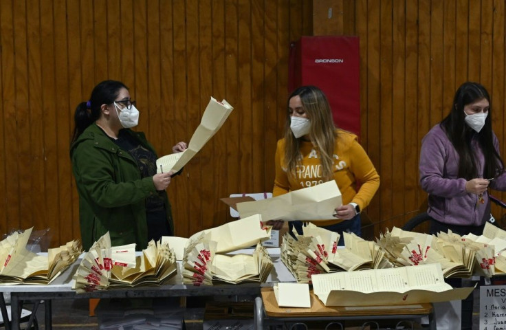 Counting votes in Santiago, Chile, during elections to choose mayors, councillors and a commission to rewrite the constitution