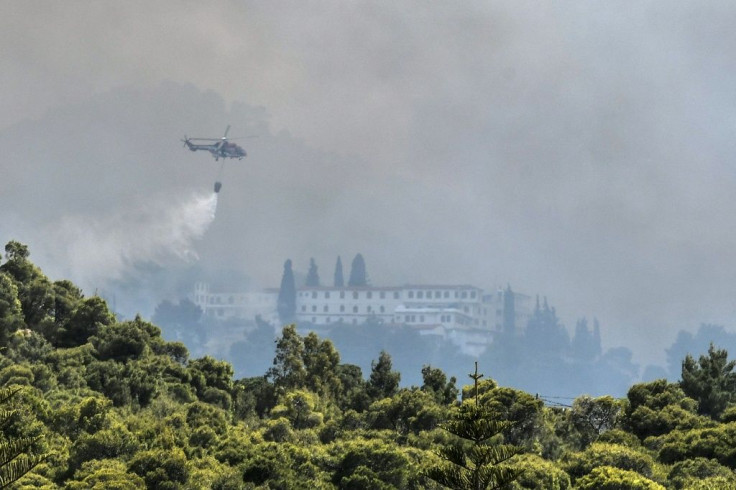 Firefighters used helicopters to tackle the blaze threatening villages and monasteries