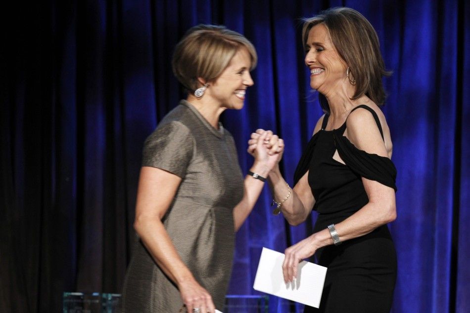Host Meredith Vieira R greets journalist Katie Couric as she walks onstage to present an award during the National Board of Review Award ceremony in New York January 12, 2010.
