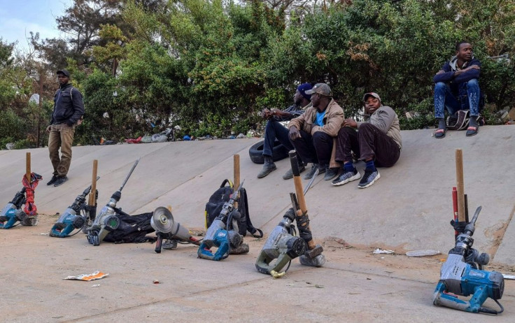 Power tools lined up in front of the work-hungry migrants in Tripoli