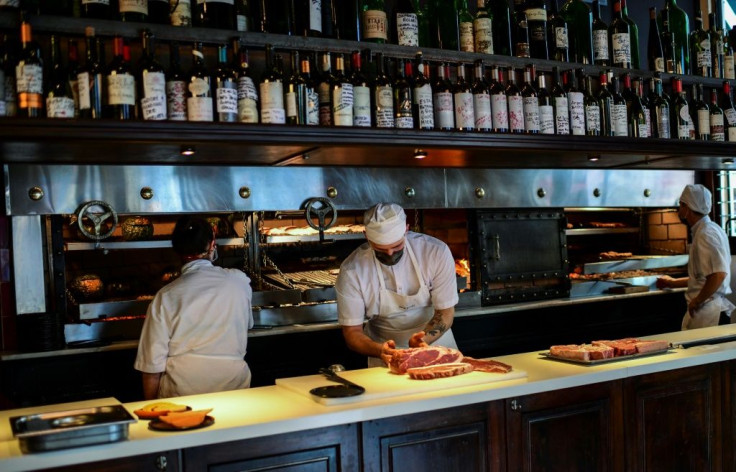 A chef prepares grilled beef at the famous Don Julio restaurant in Buenos Aires' trendy Palermo district