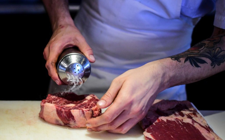 A chef prepares meat in the kitchen of Buenos Aires' Don Julio restaurant -- recognized in 2020 as the best in Latin America by the prestigious 50 Best Restaurants ranking