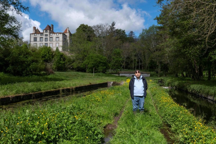 Pierre Grodecoeur outside his home in Les Moulins Blanc, where a stream once as deep as his knee now sometimes runs dry