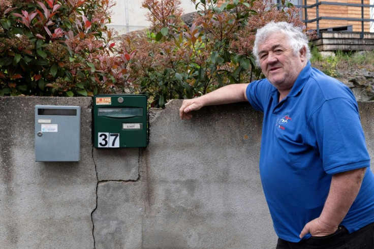 Pierre Grodecoeur outside his home in Les Moulins Blanc, where a stream once as deep as his knee now sometimes runs dry