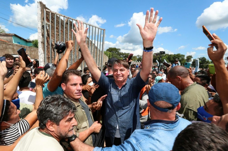 President Jair Bolsonaro ignored state Covid-19 safety regulations when he met with hundreds of supporters at an unscheduled visit to the city of Senador La Rocque in Maranhao state, Brazil on May 21, 2021