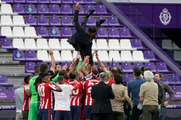 Air travel: Atletico Madrid players toss coach Diego Simeone into the air