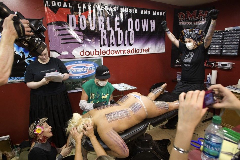 Body piercer Bill Robinson and sideshow performer Staysha Randall break the Guinness Book record in Las Vegas
