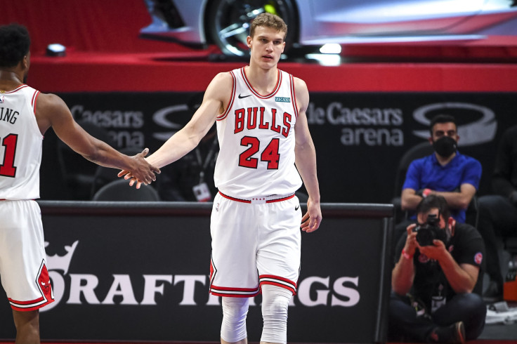 Thaddeus Young #21 of the Chicago Bulls high fives Lauri Markkanen #24 of the Chicago Bulls