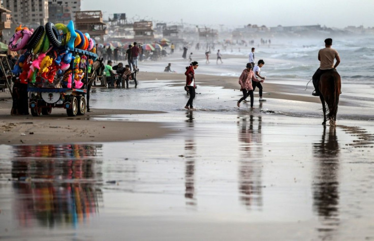 Palestinians gather at Gaza City's beach on May 22  following the ceasefire
