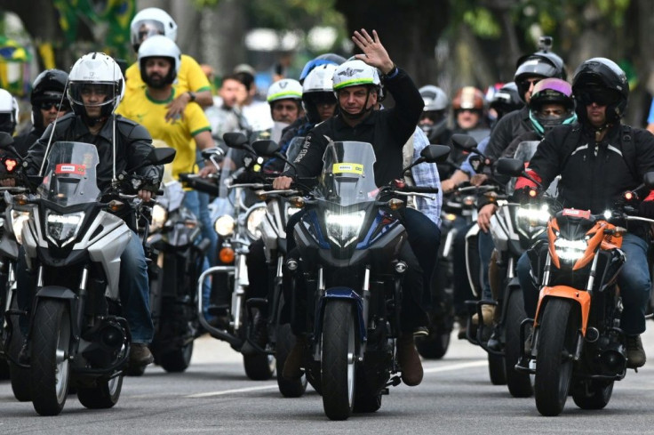 Brazilian President Jair Bolsonaro waved to supporters as he led a motorcyle parade