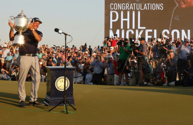 Phil Mickelson hoists the Wanamaker Trophy after winning the 2021 PGA Championship and becoming, at 50, the oldest major winner in history