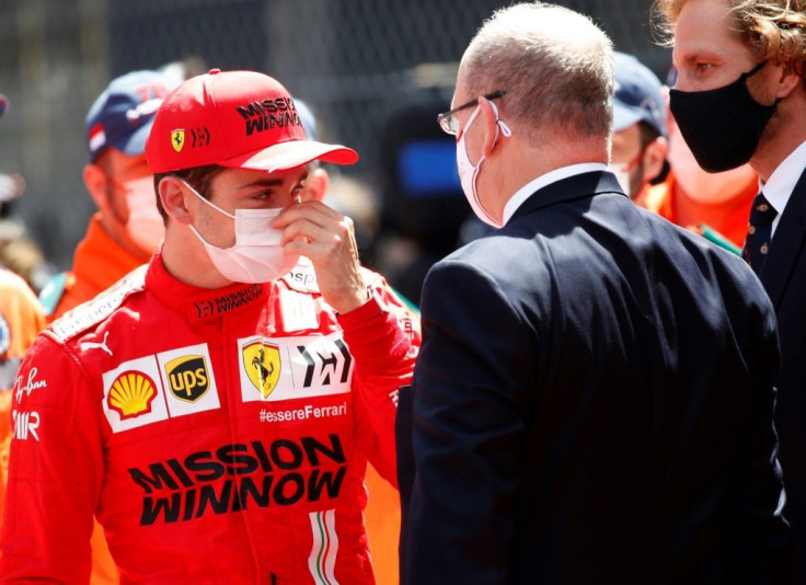 Royal touch: Prince Albert II of Monaco speaks with Ferrari's Charles Leclerc
