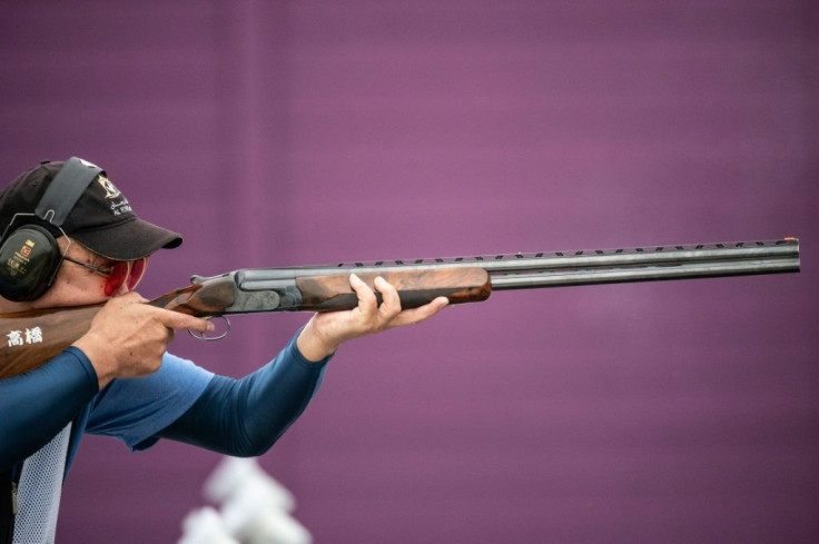 Kiyoshi Takanashi of Japan competes in the trap women and men final during a test event for the Tokyo 2020 Olympics last week. An athlete competes at a shooting test event for the Tokyo 2020 Olympics. Japan's strict gun laws are posing unusual problems at