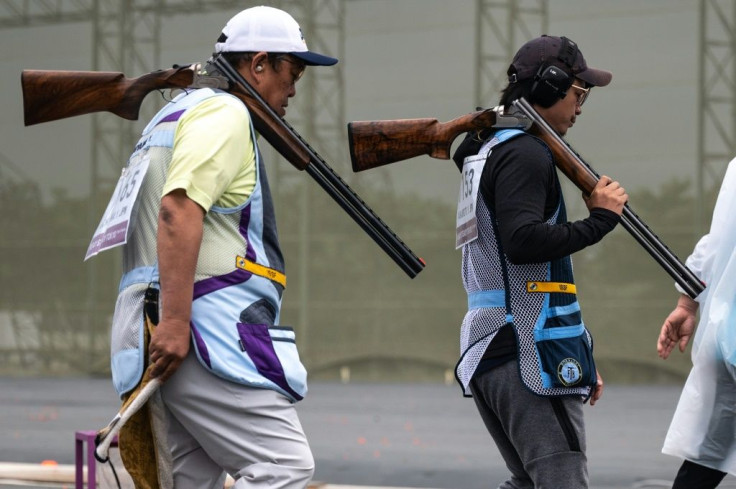 Athletes rest between rounds at an Olympic shooting test event for the Tokyo 2020 Olympic Games at Asaka Shooting Range in Nerima district of Tokyo