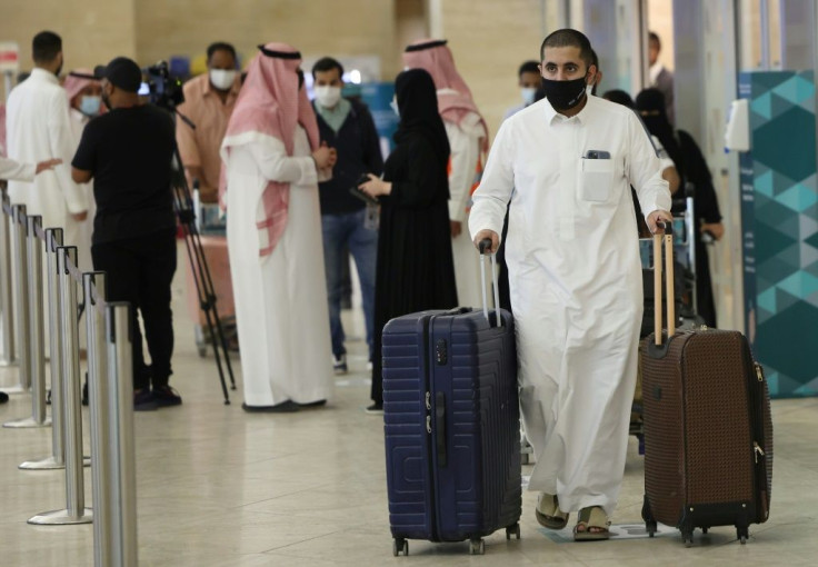 Saudi passengers arrive at the King Khalid International Airport in the capital Riyadh on May 17, 2021, as Saudi authorities lift travel restrictions for citizens immunised against Covid-19