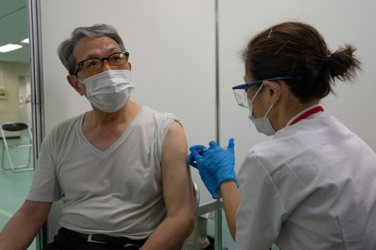 Japan's first mass vaccination centres opened with just two months until the Olympics starts