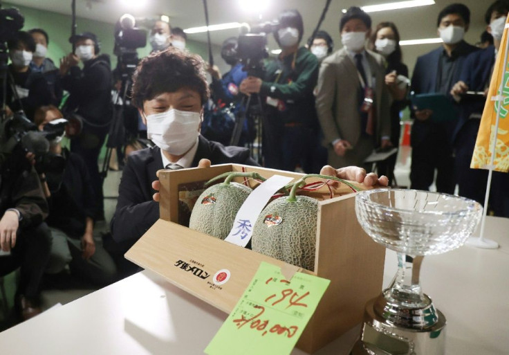 A pair of prize melons has sold in Japan for nearly $25,000, recovering from a pandemic price slump