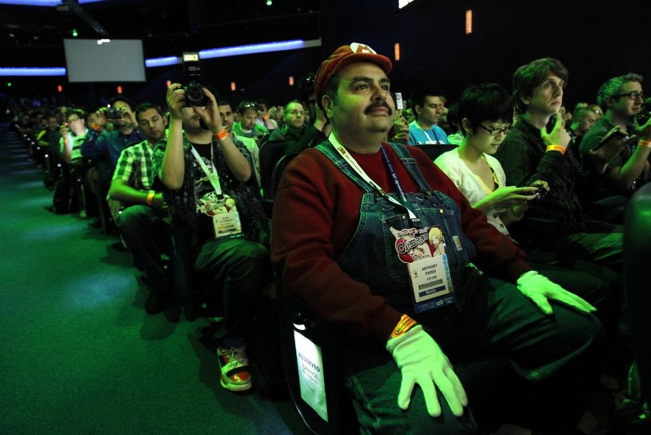 Guest Anthony Parisi is dressed like the videogame character Mario as he attends a Nintendo media briefing during the Electronic Entertainment Expo, or E3, in Los Angeles June 7, 2011.