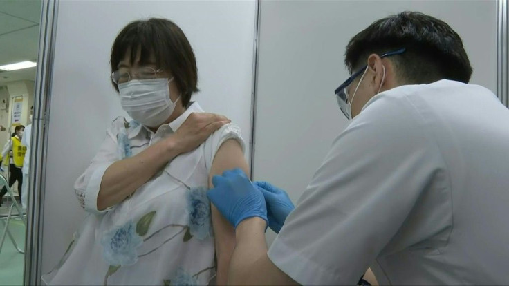 Eldery receive Covid-19 shots as mass vaccination center opens in Tokyo