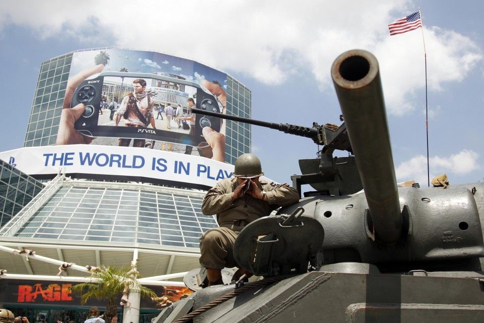 A man yells into a World War II Sherman M4A3 military tank as they start the engine outside of the Los Angeles Convention Center during a promotion for the video game quotWorld of Tanksquot from British developer Wargaming.net during the Electronic En