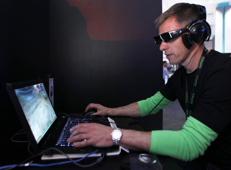 An attendee plays Everquest in 3-D wearing Sony's 3-D glasses and PC gaming audio headset at the Sony Online Entertainment booth during the Electronic Entertainment Expo or E3 in Los Angeles June 7, 2011.