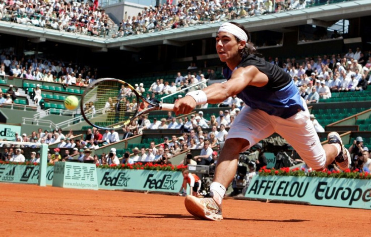 At a stretch: Rafael Nadal returns the ball to Novak Djokovic in their 2006 Roland Garros quarter-final, the pair's first career meeting