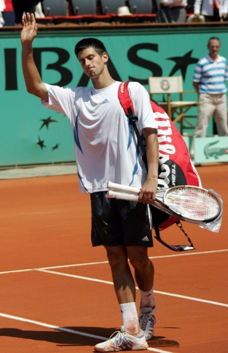 All over: Novak Djokovic retires at two sets down to Rafael Nadal in the 2006 quarter-final