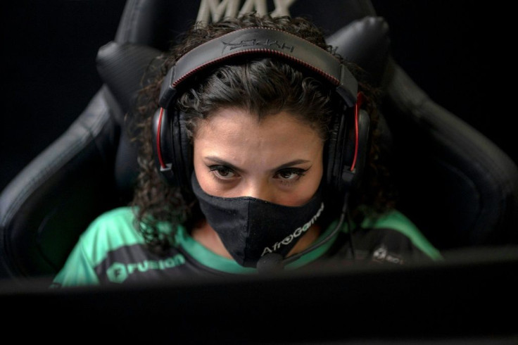 AfroGames e-sports team member Gabriela Ferreira, 19, plays a video game called League of Legends (LoL) during a game tactics class at the NGO AfroReggae headquarters of the Vigario Geral favela in Rio de Janeiro