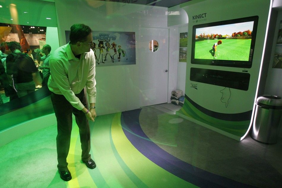 An attendee plays the Kinect Sports Season 2 for the Xbox 360 Kinect during the Electronic Entertainment Expo, or E3, in Los Angeles June 7, 2011.