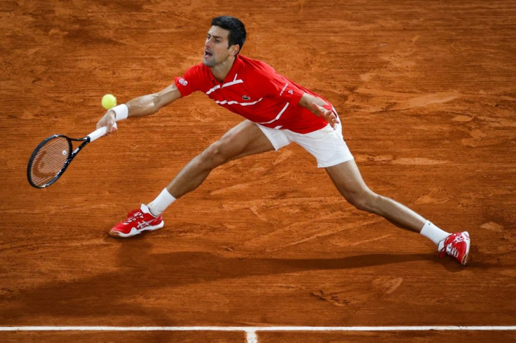 At a stretch: Novak Djokovic in action in last year's final