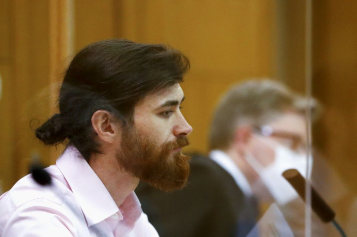 Defendant Franco Albrecht was previously arrested in 2017 while trying to retrieve a Nazi-era pistol he had hidden in a toilet at Vienna's international airport, and his fraud was discovered when his fingerprints matched two separate identities