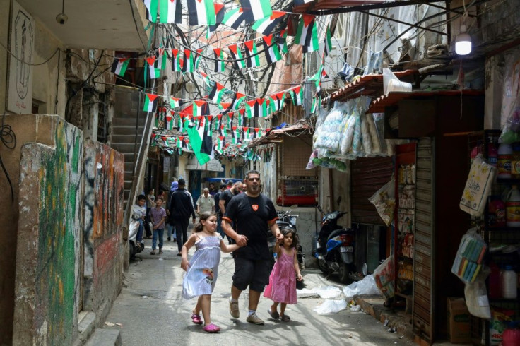 Palestinian flags line an alley in the Palestinian refugee camp of Shatila in Lebanon's capital Beirut on May 21