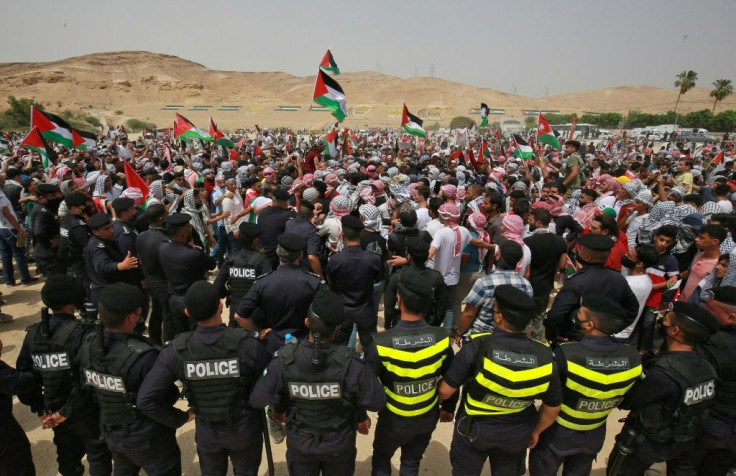 Rallies in solidarity with the Palestinians have been held in several countries; here Jordanian police surround protesters during a demonstration in Karameh